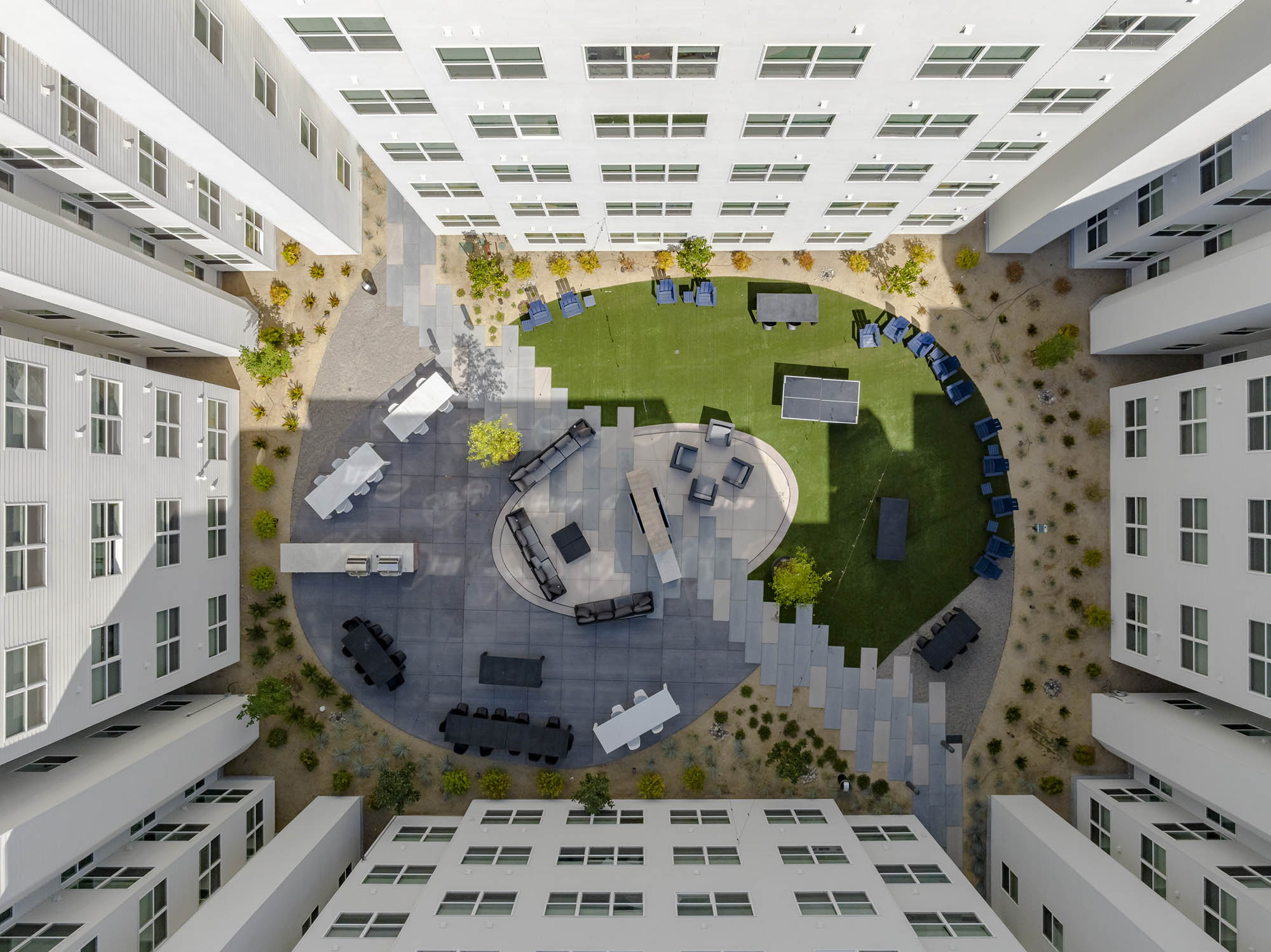Aerial view of a courtyard with seating areas and greenery