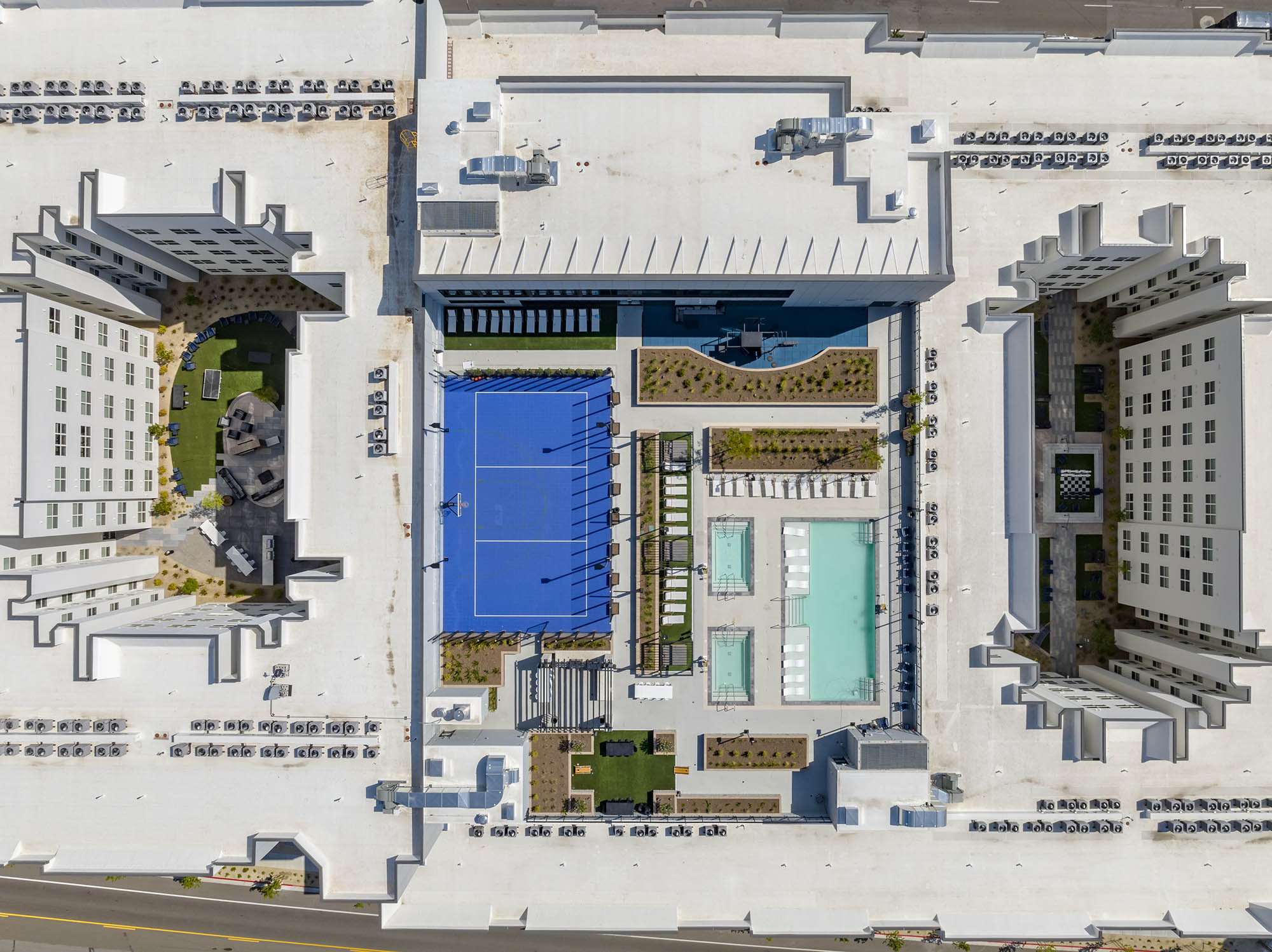 Aerial view of a hotel with pools and recreational areas