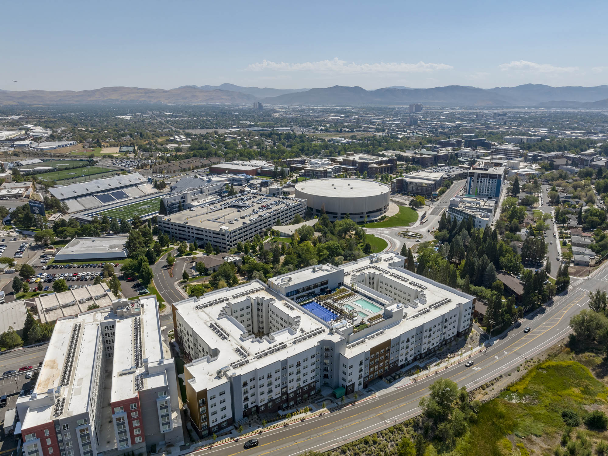 Aerial view of urban area with buildings roads and mountains