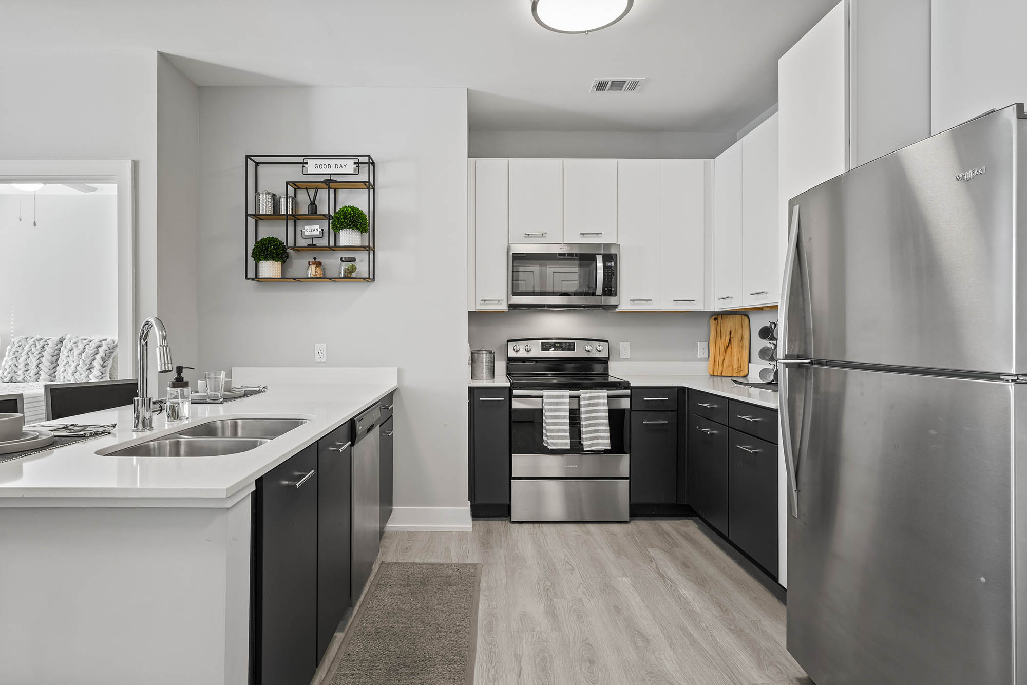 Modern kitchen with stainless steel appliances and black cabinets