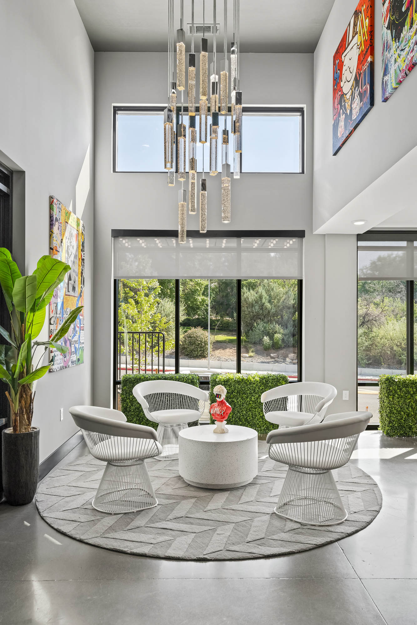 Modern lounge area with decorative art and greenery