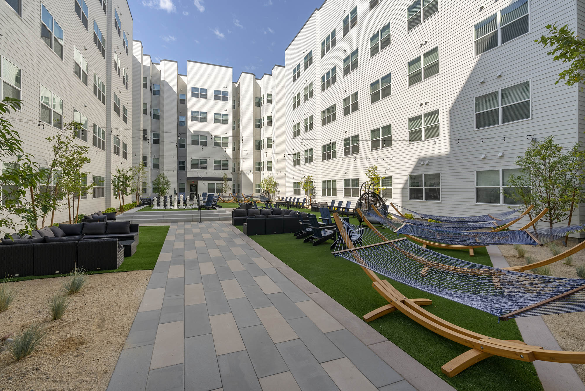 a modern courtyard featuring hammocks lounge seat