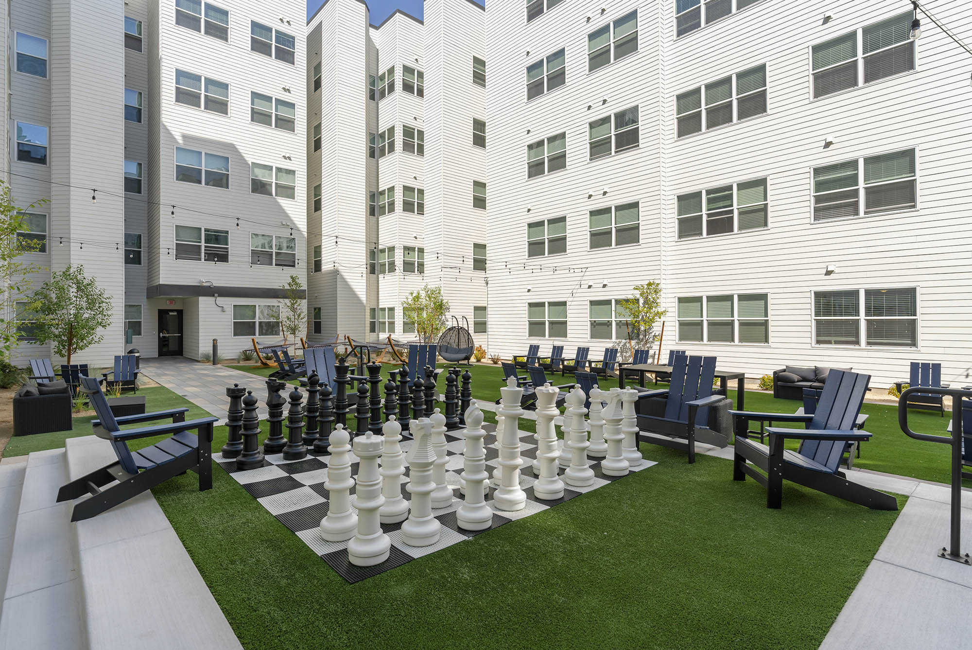 a modern outdoor space featuring a large chess set