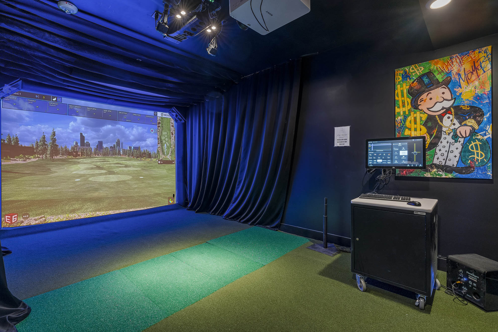 indoor golf simulator with a large screen displayi
