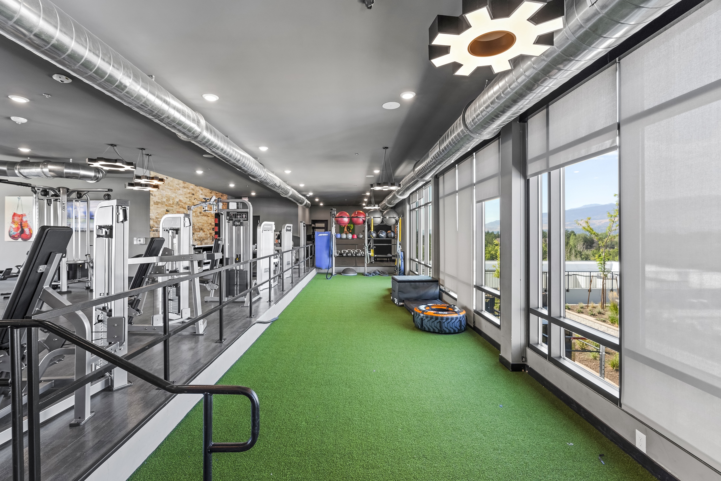 modern gym interior featuring workout machines gr