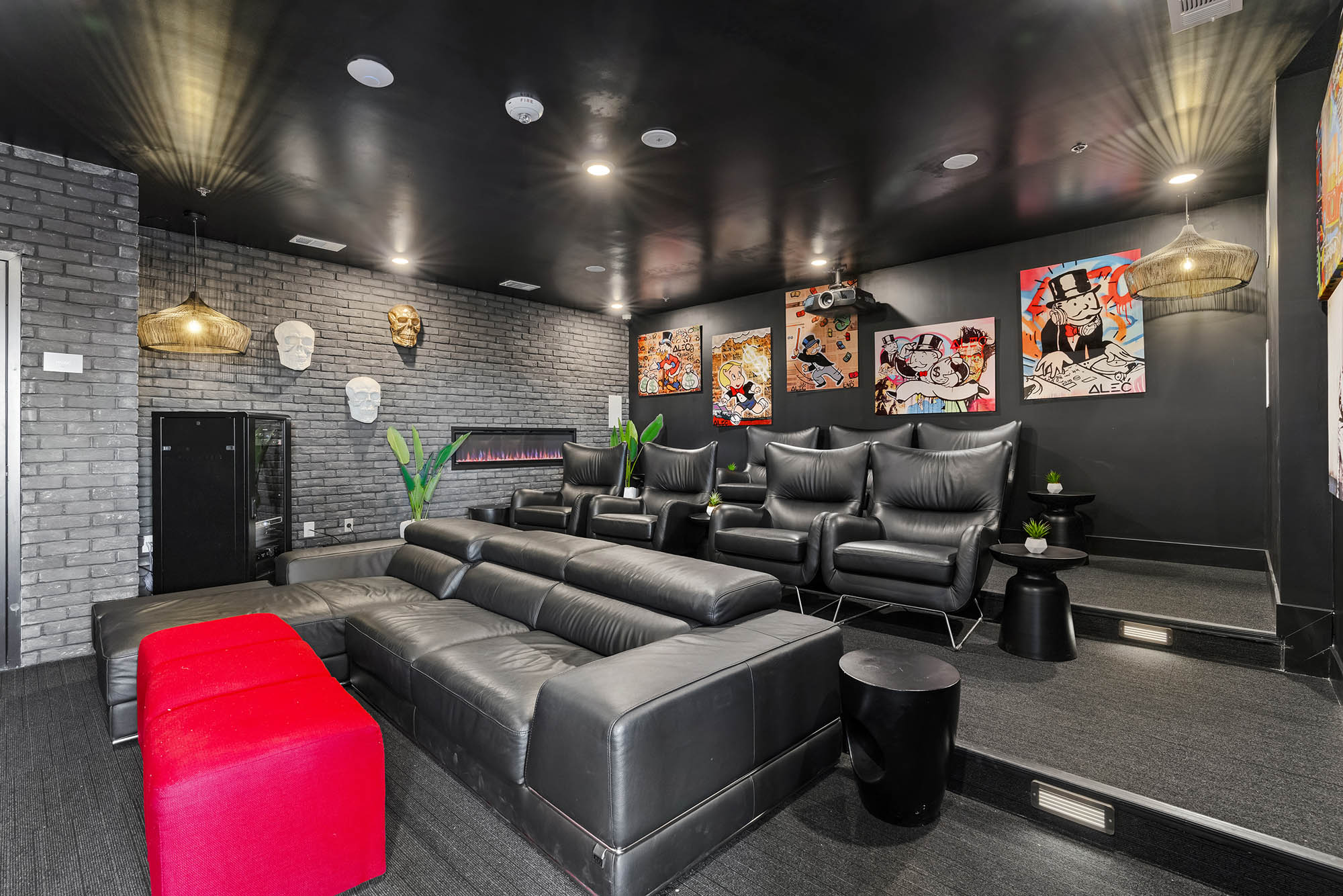 modern home theater with black leather seating co