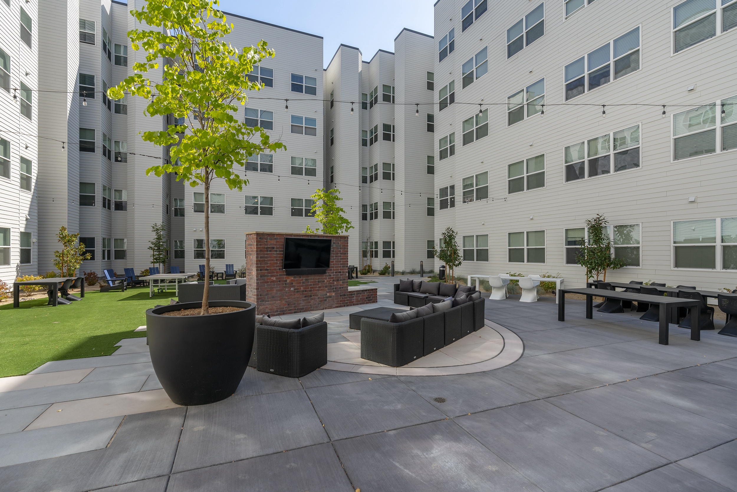 modern outdoor courtyard with seating area trees